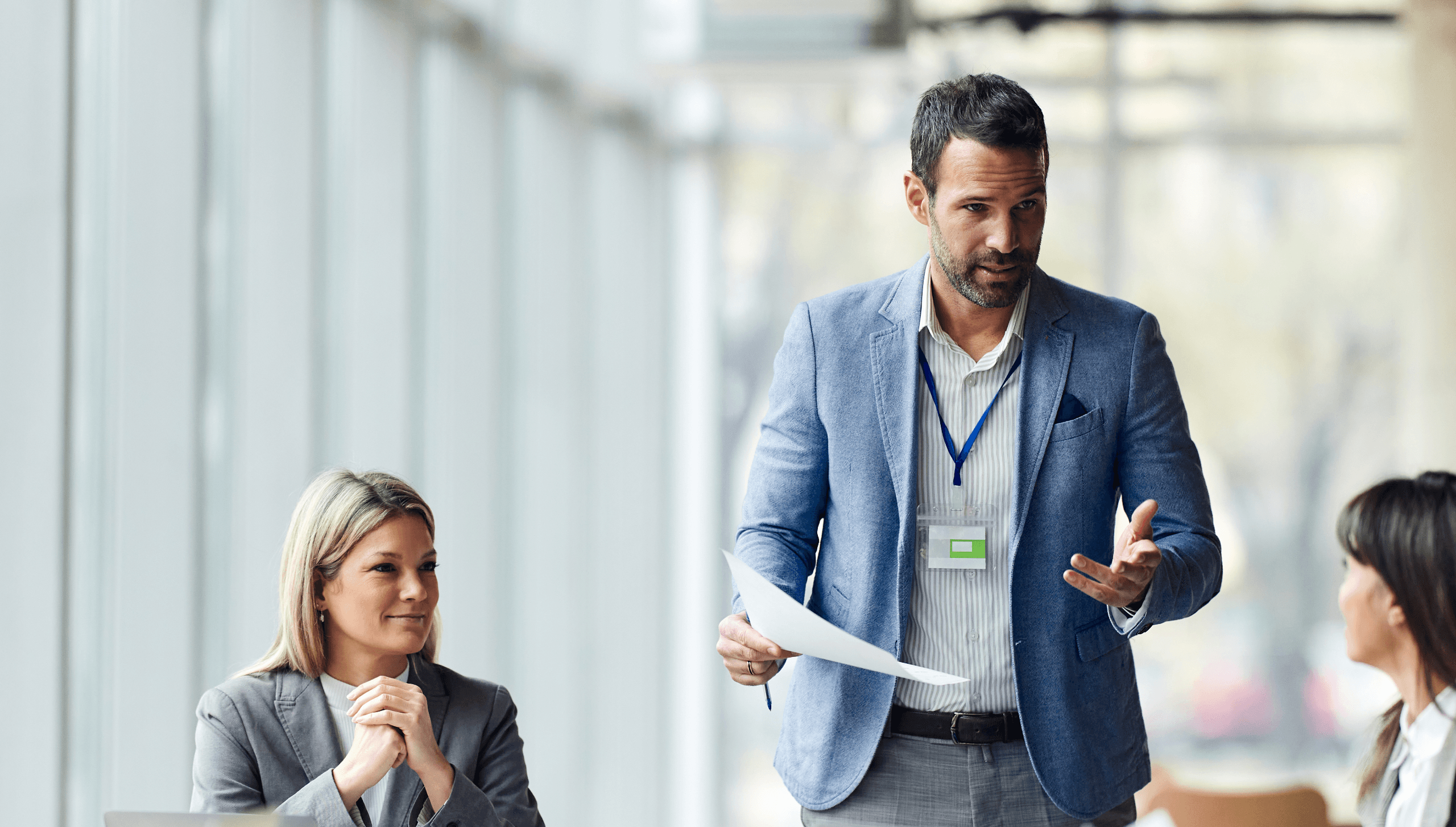 business man presenting in front of group